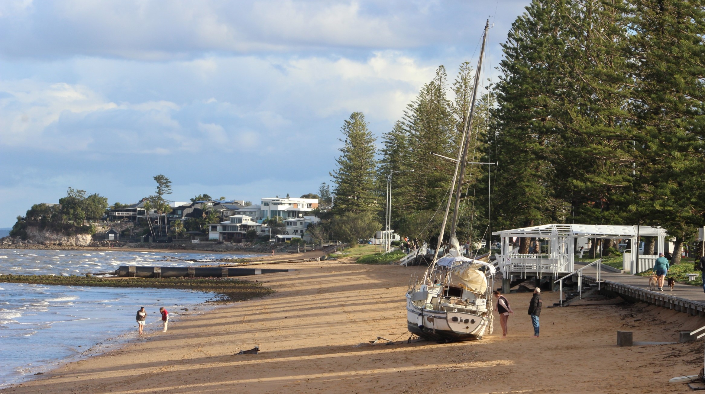 The damaged yacht stranded at Margate Beach, Redcliffe, on Sunday, August 10, 2025. NB: Name blurred to protect privacy. Photo: ANDREW KACIMAIWAI