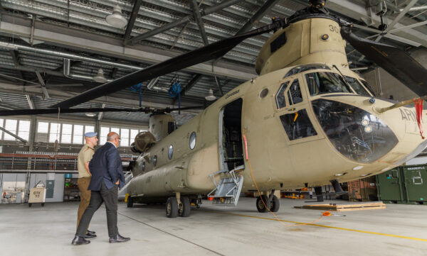 Assistant Defence Minister Peter Khalil is guided around the 5th Aviation Regiment hanger, and this Chinook, at RAAF Base Townsville. Photo: Department of Defence.