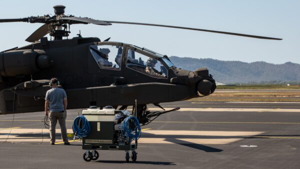 US pilots prepare for a post-delivery test flight of a new Australian Army Apache helicopter in Townsville. Photo: Department of Defence