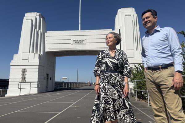 Moreton Bay Councillor Karl Winchester and Julie Hornibrook at the Hornibrook Bridge portal in Clontarf.