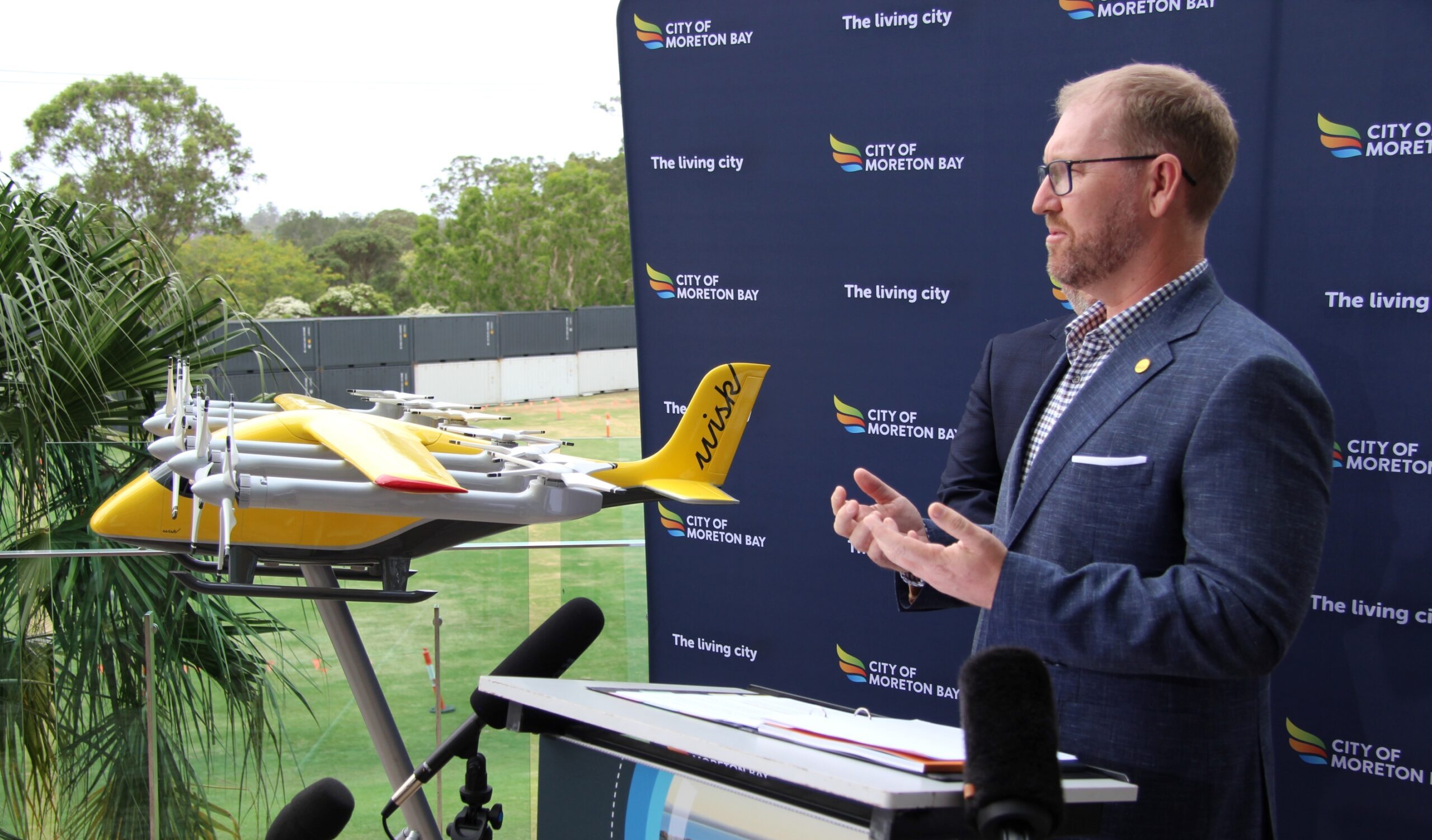 Flying .... Wisk Aero's Dan Parsons explains the flying robot taxi to journalists on Friday. Photo: ANDREW KACIMAIWAI