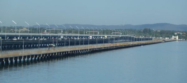 A July 2010 photo of the Hornibrook Bridge (foreground), Houghton Highway (centre) and Ted Smout Bridge (background). Image courtesy of Moreton Bay City.