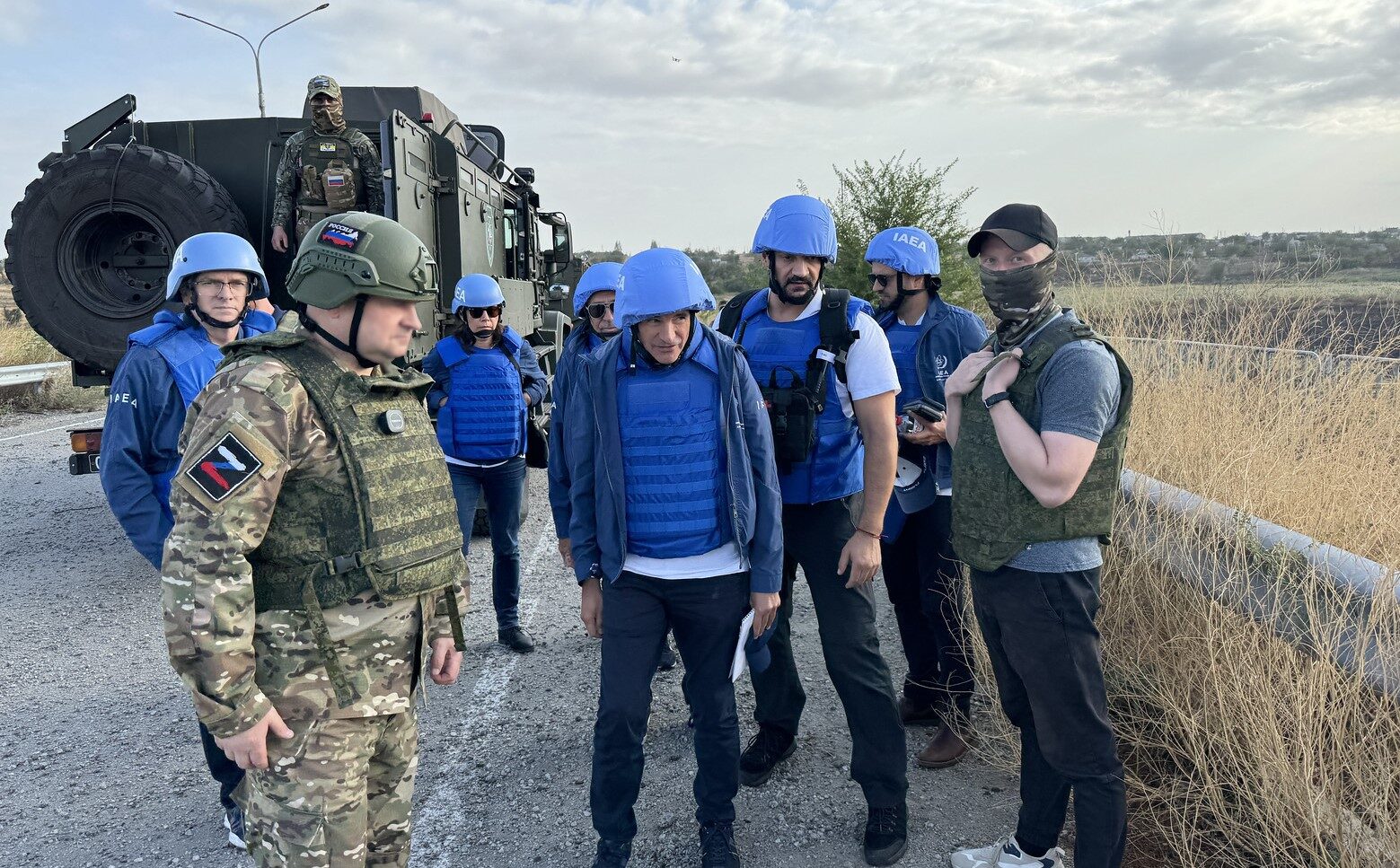FILE … IAEA chief Rafael Mariano Grossi (Centre) and team with an Ukrainian escort at a frontline crossing near the Zaporizhzhya nuclear power plant in September 2024. Photo: Fredrik Dahl / IAEA