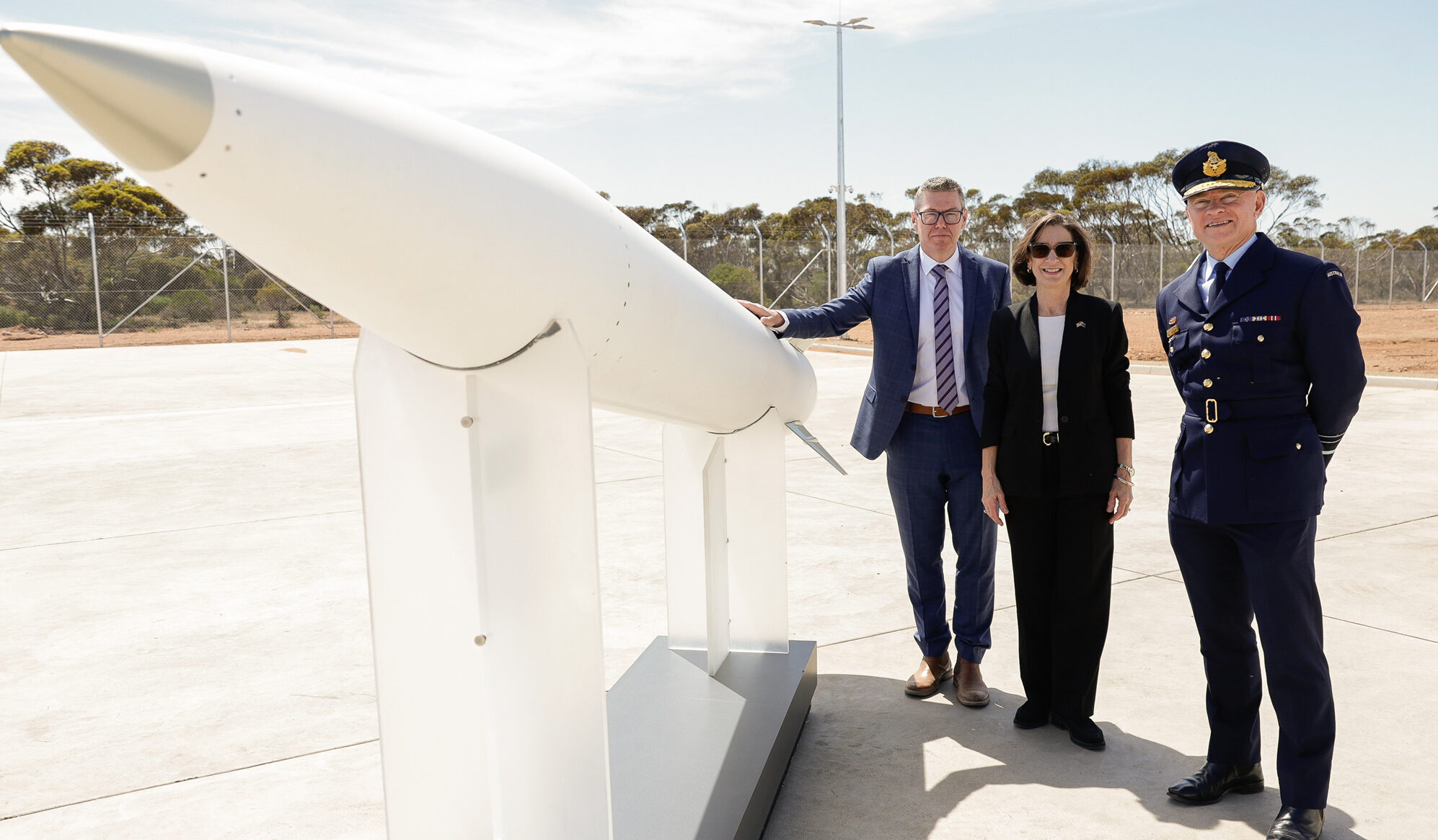 Pat Conroy (left) with Lockheed-Martin’s Paula Hartley and Air Marshal Leon Phillips and a missile at the Port Wakefield factory. Photo: Department of Defence