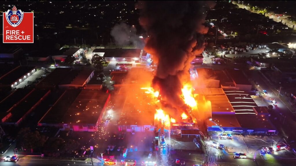 EPA ... Firefighters and trucks at the scene of the fire overnight on Saturday. Photo: FRNSW