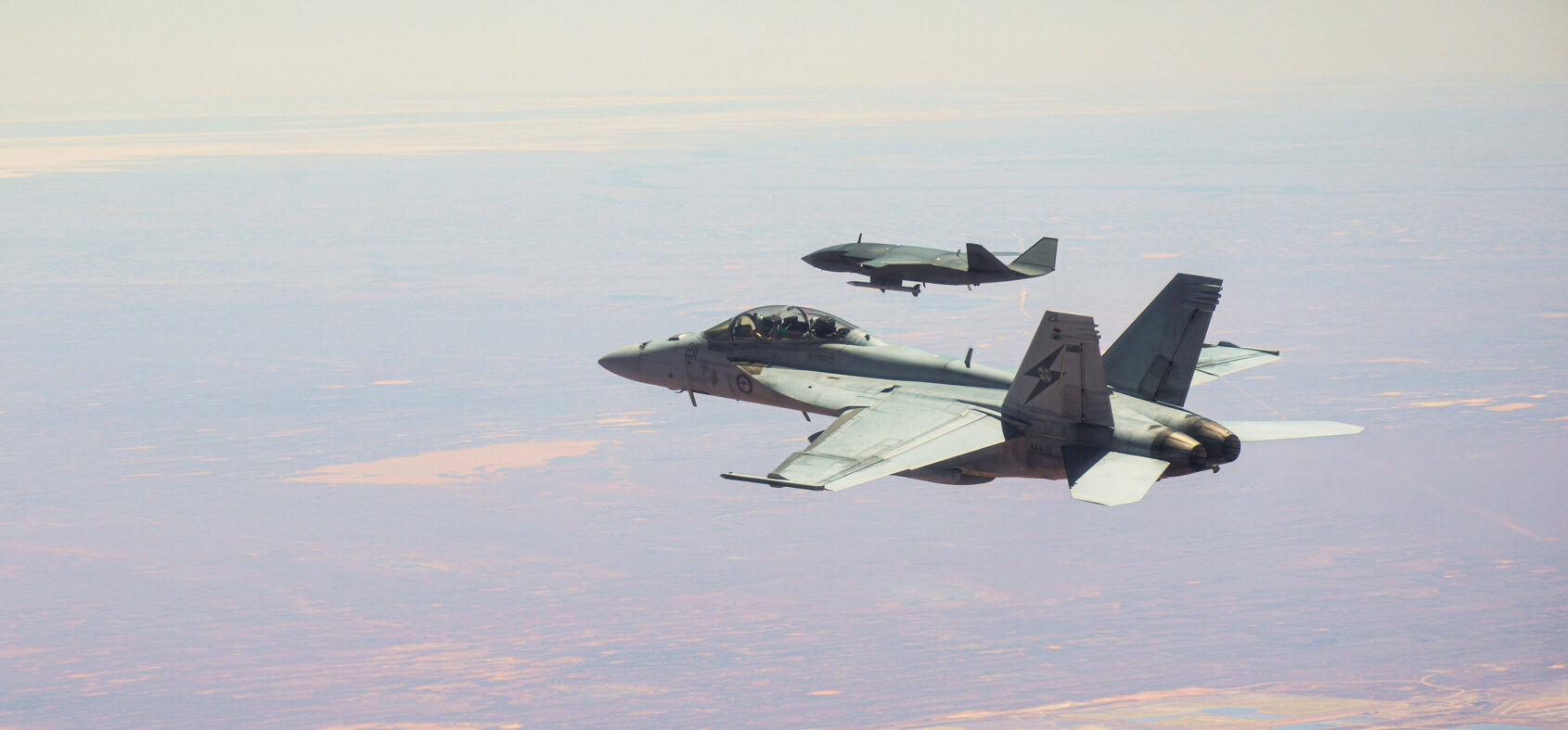 anti-drones ... An RAAF Ghost Bat unmanned aircraft is followed by a Super Hornet during aerial trials over Woomera, SA. On this flight, the Ghost Bat shot down an aerial drone with its missile. Photo: Department of Defence