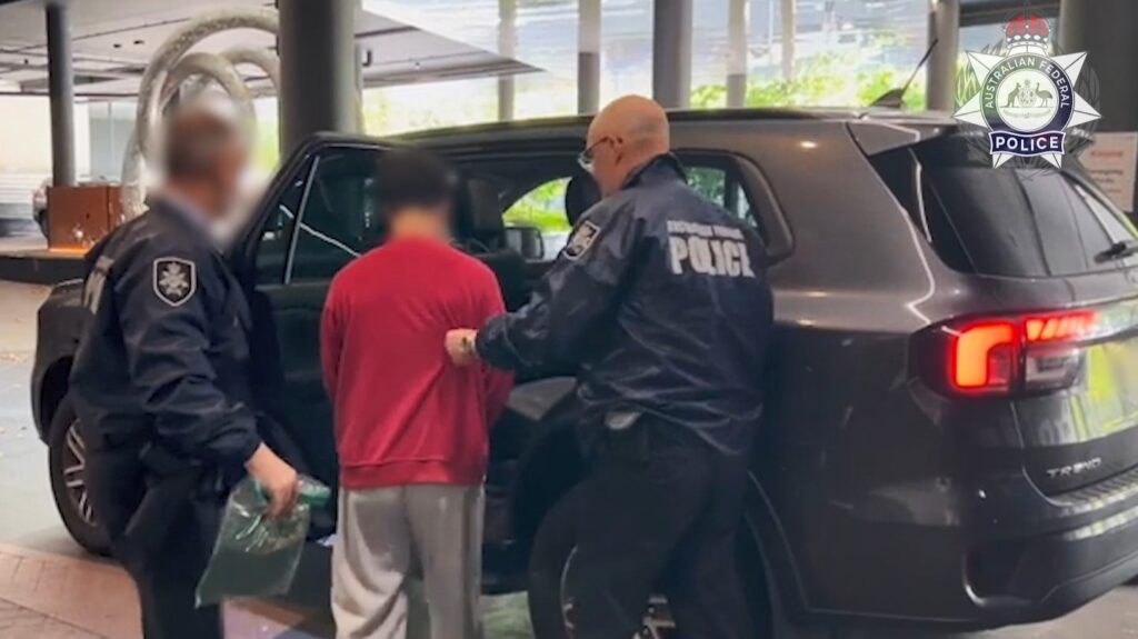 A screen grab of one of the Chinese nationals under arrest. Image supplied: AFP.