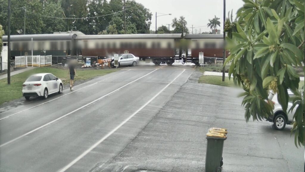 A screen capture of the Grove Street collision from video footage released by Queensland Rail.