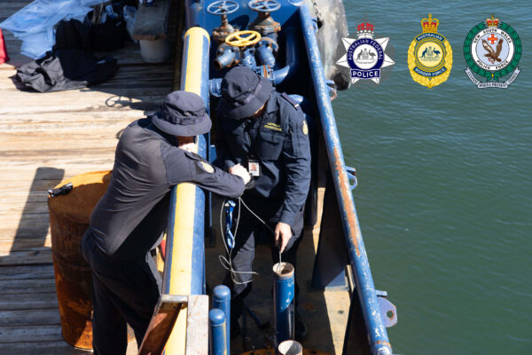 crew .... Police officials search the vessel at anchor in Sydney Harbour. Photos: supplied.