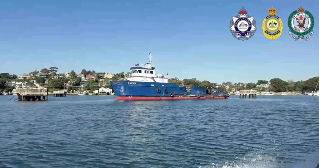 Crew ... Police officials search the vessel at anchor in Sydney Harbour. Photos: supplied.
