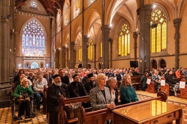 Attending Mass inside St Patrick's Cathedral, Melbourne. Photo: Casamento Photography.