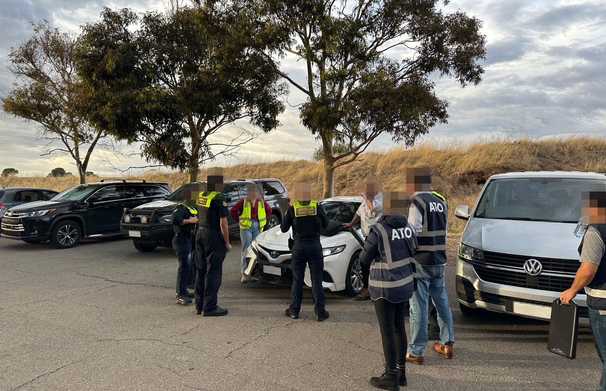 Federal officers talk to staff and workers at one of the SA vineyards as part of Operation Zephyr. Photo: ATO/supplied.