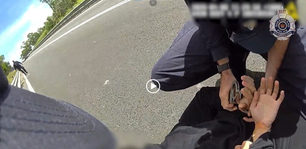 A screen capture of video footage of a police officer making an arrest. Image: Qld Police
