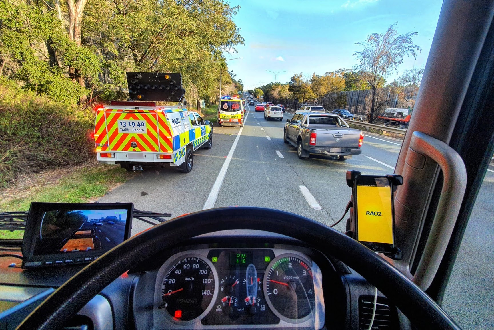 tow trucks ... Queensland is going back on complying with ‘slow down’ laws, the RACQ ays. Photo: RACQ