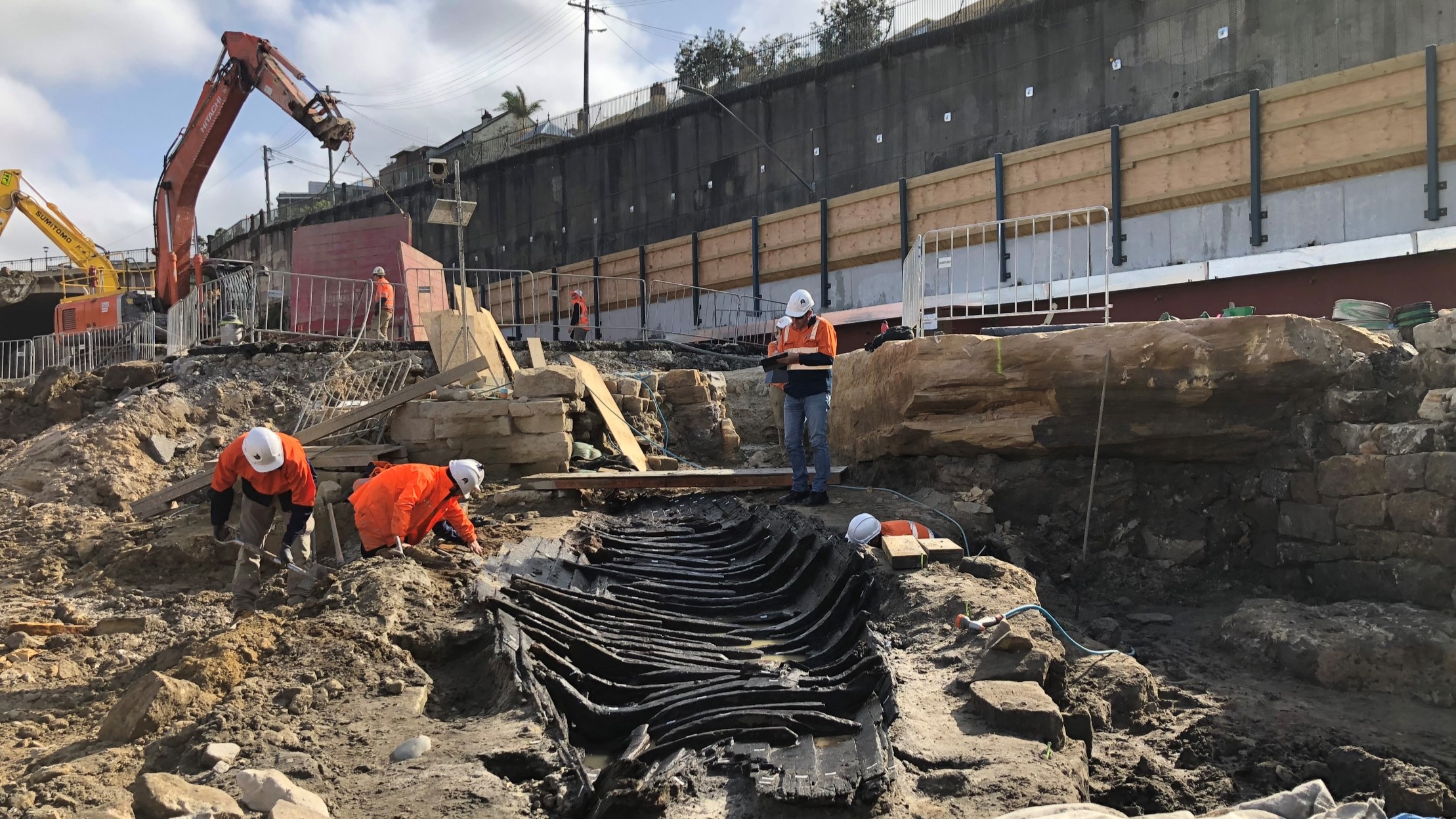The ‘Barangaroo Boat’ freshly uncovered during excavation of the Metro Station in 2018. Photo: Casey & Lowe, Sydney Metro, 2018.