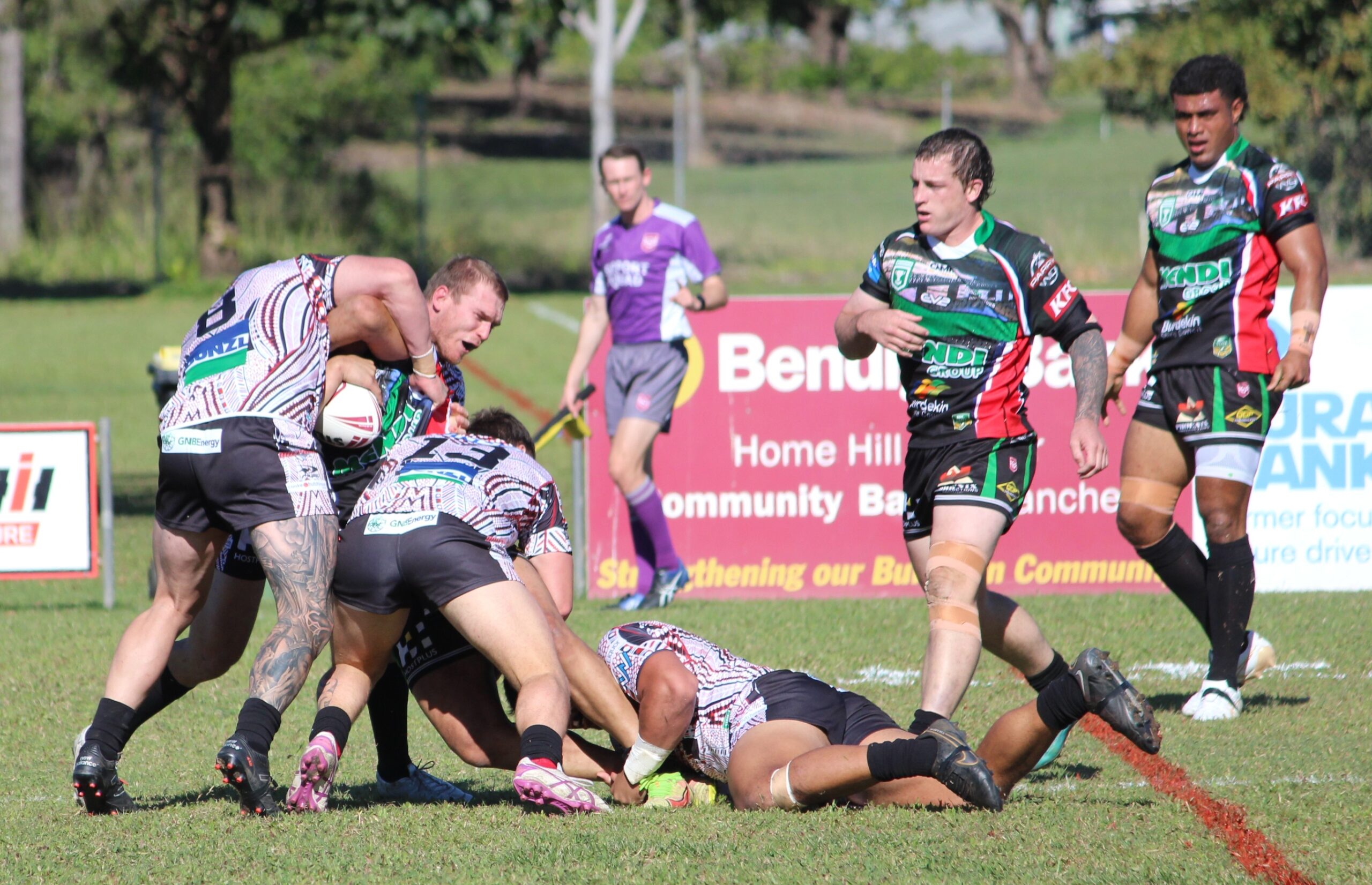 FILE … Burdekin vs Townsville (green and black) at Ayr. Regional footy is expected to benefit from the new ‘Magic Week’, the state government says. Photo: ANDREW KACIMAIWAI