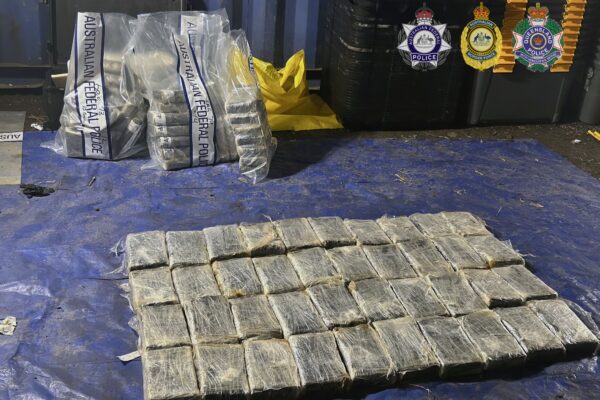 Two have been arrested over a record cocaine haul seized at a western Sydney property. Photos: AFP.