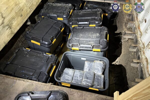 Two have been arrested over a record cocaine haul seized at a western Sydney property. Photos: AFP.