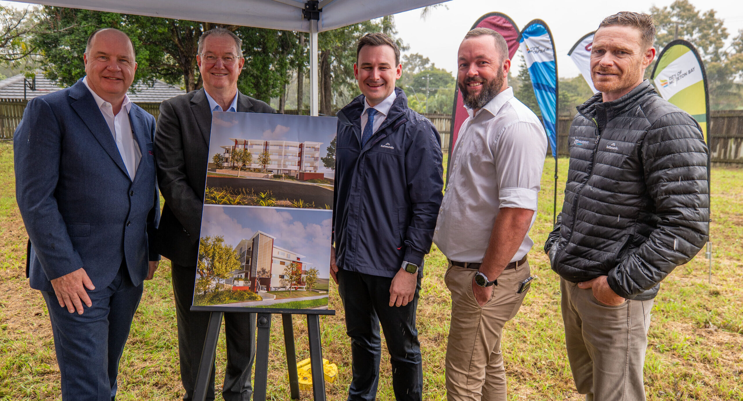 Non-profit ... Coast2Bay Housing CEO Andrew Elvin, Mayor Peter Flannery, Housing Minister Sam O'Connor, Cr Tony Latter and Murphy Builders director Mark Berry at the Morayfield site. Photo: Moreton Bay Council.