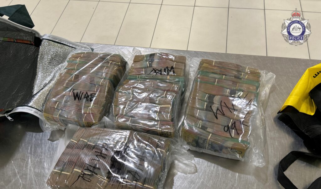 Some of the seized $712,850 seized by federal police, containing bundles of $50 and $100 notes. Photo: AFP