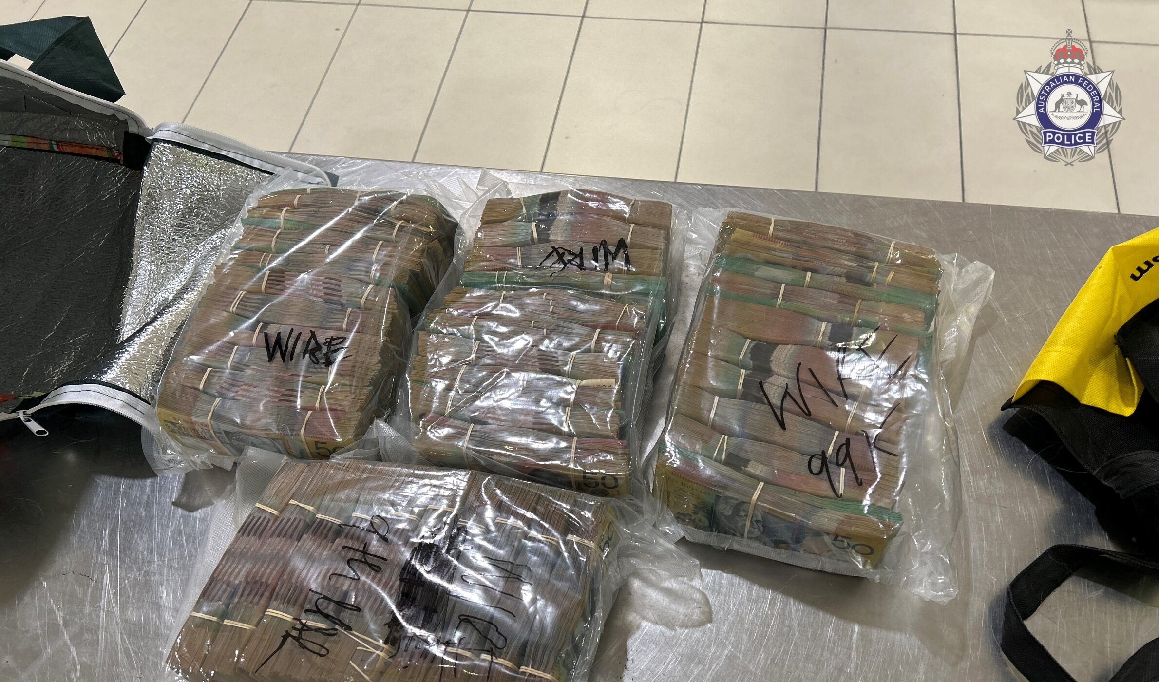 Some of the seized $712,850 seized by federal police, containing bundles of $50 and $100 notes. Photo: AFP