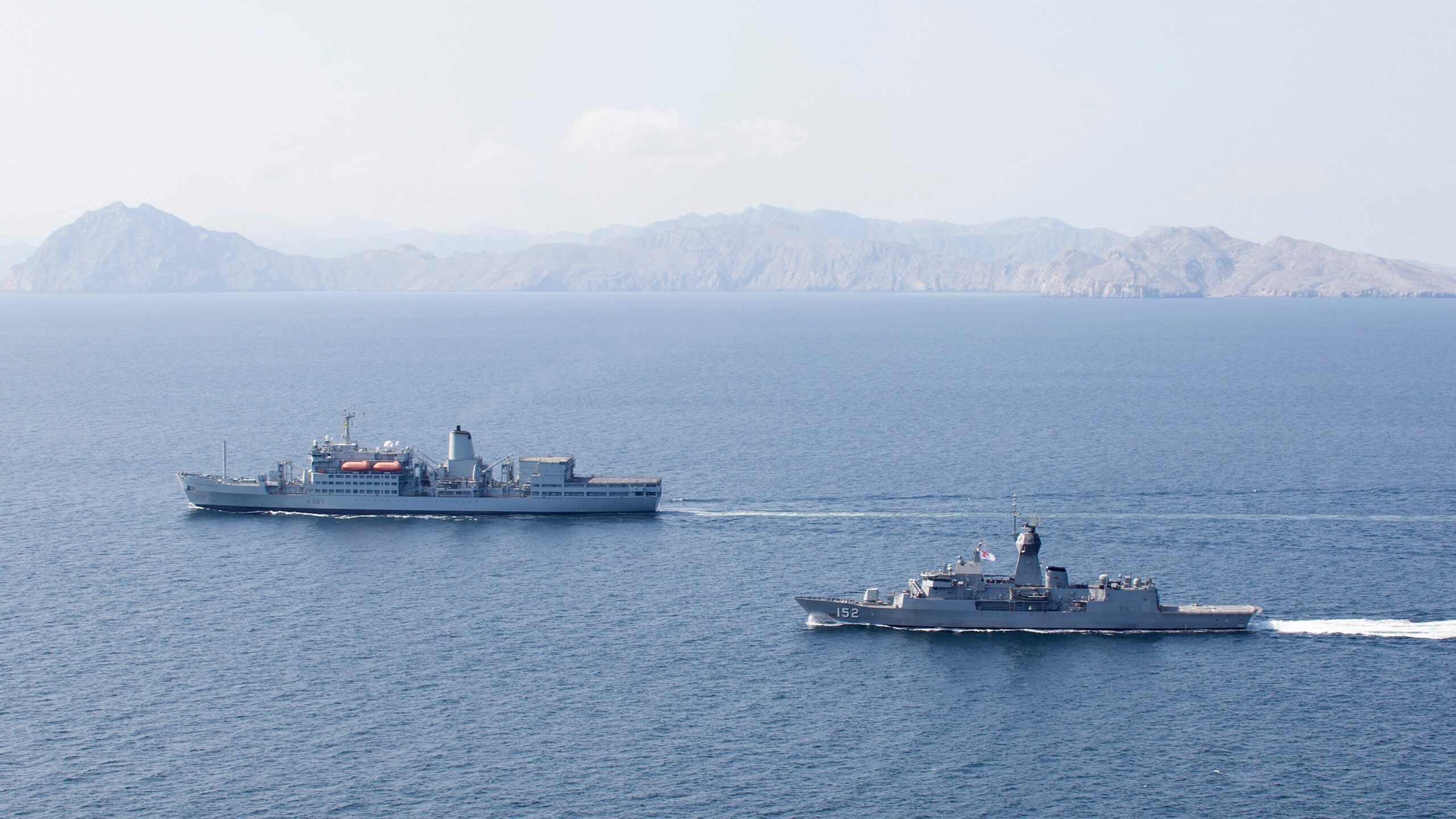 Fuel ... The HMAS Warramunga (right) escorts the RFA Fort Rosalie (UK) through the Strait of Hormuz during a 2017 deployment. Photo: Department of Defence.