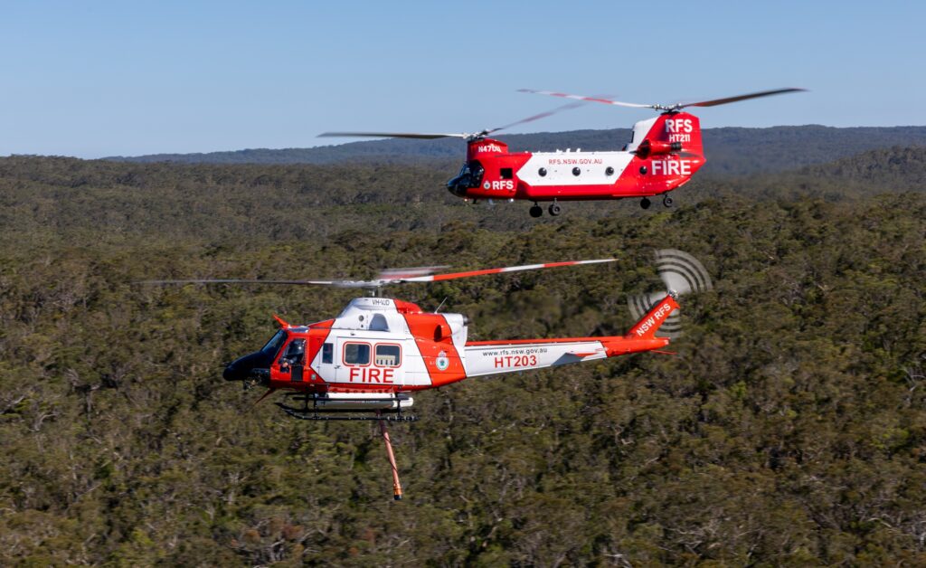 The NSW RFS Bell support helicopter (foreground) with the Chinook which can operate 24-hours. Photo: supplied