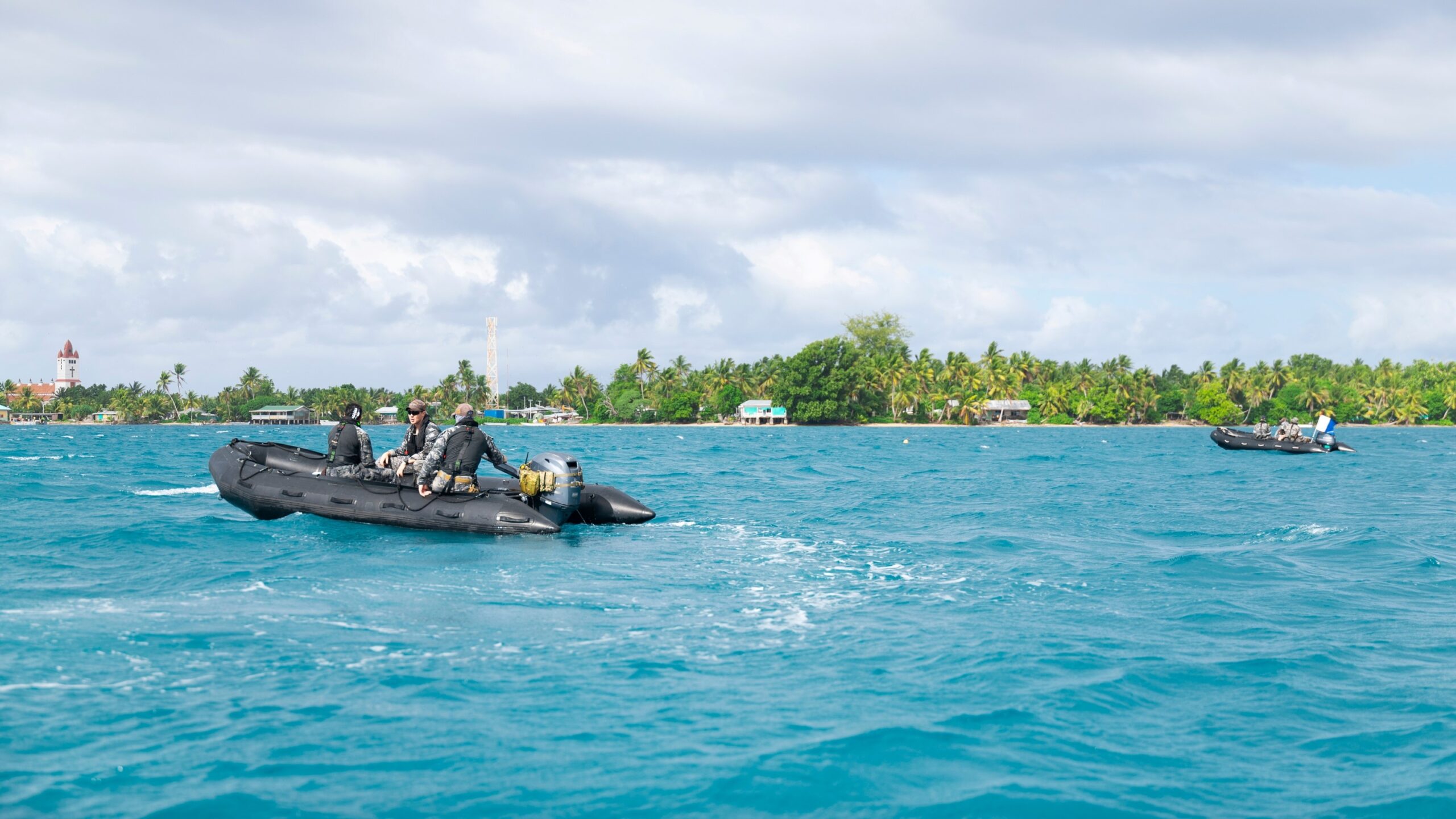 Navy clearance divers search Nanumea Lagoon, Tuvalu, as part of Operation Render Safe. Photo: Department of Defence