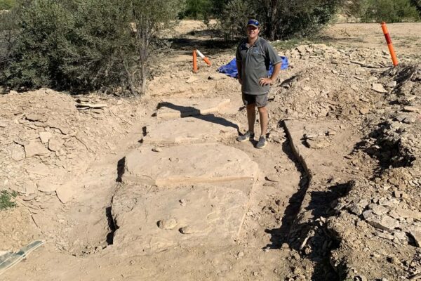 frozen ... Curator Kevin Petersen with the exposed specimen on site. Photo: supplied
