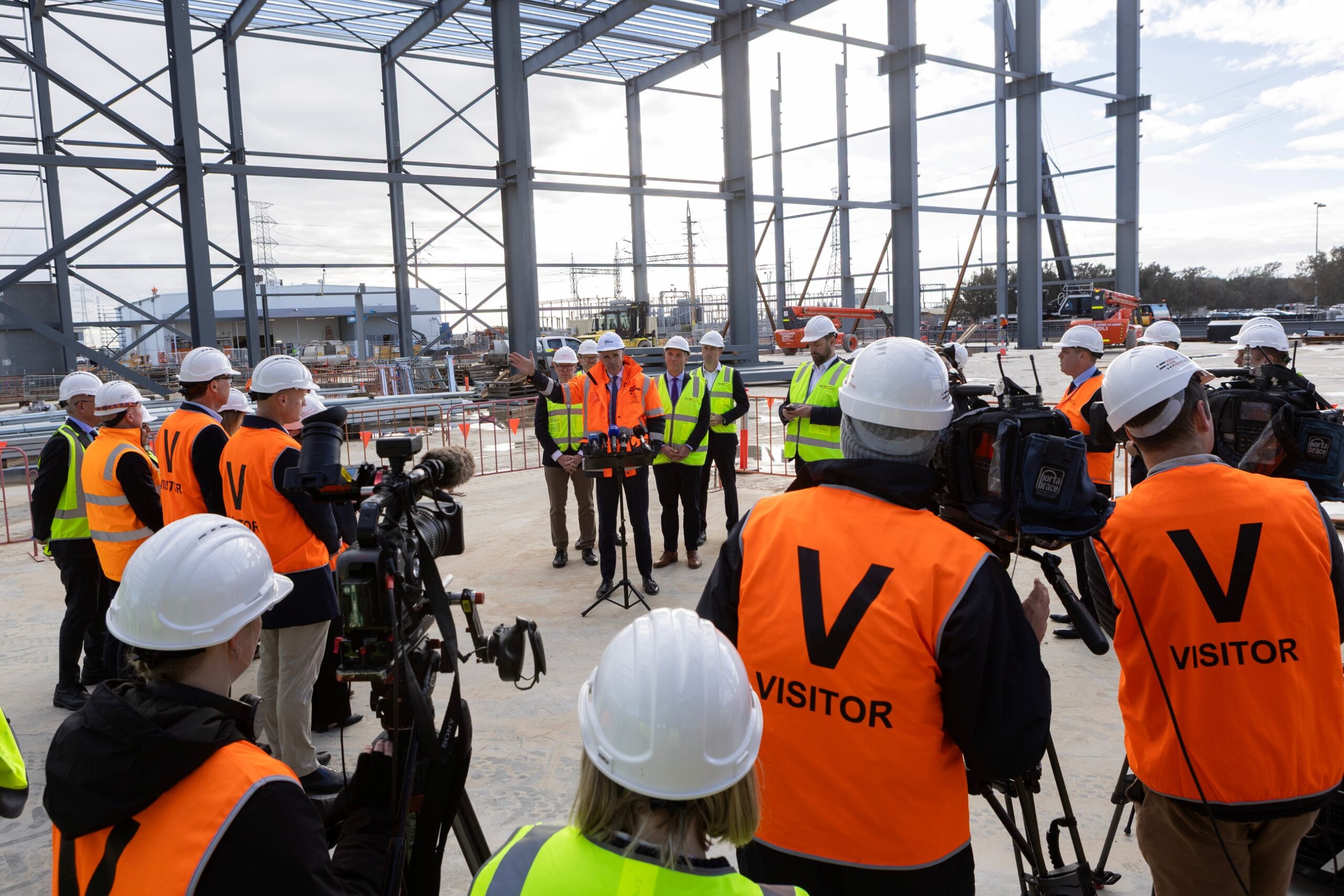 roads ... SA Premier Peter Malinauskas addresses media after a tour of new building works at the Osborne Naval Shipyard last month. The press conference was to announce an extra $4.6bn will be spent on the AUKUS nuclear submarine yard. It will grow 10 times in size to around 600,000 square metres of floor space and more than 50 new structures. Photo: Department of Defence