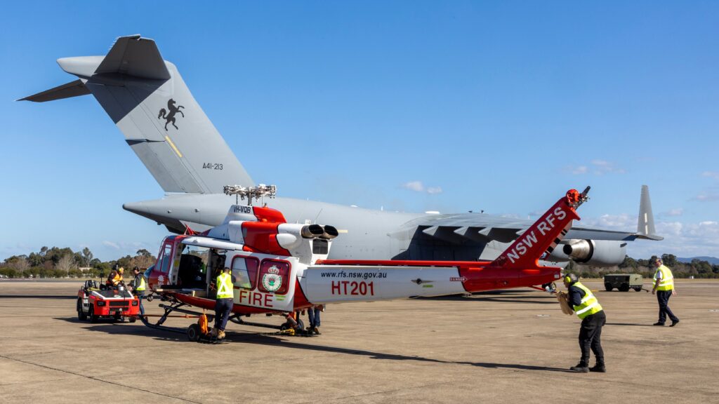 Fossil ... A NSW Rural Fire Service spotter helicopter bound for France is loaded onboard a heavy-lift Globemaster at RAAF Base Richmond. Photo: Department of Defence