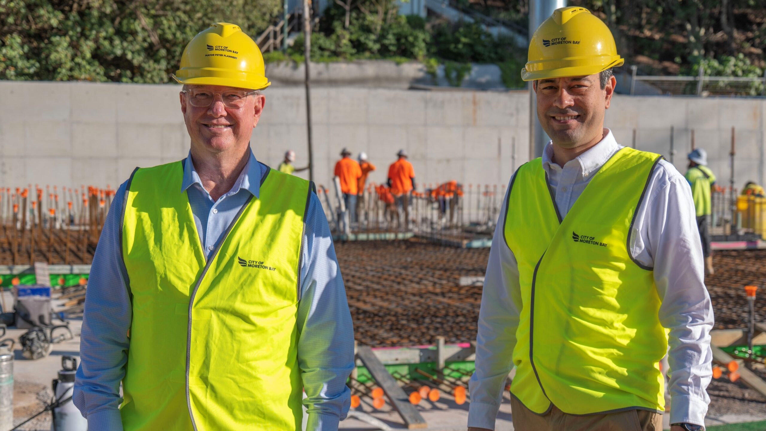 Mayor Peter Flannery (left) and Cr Karl Winchester at the beach pavilion site. Photo: Moreton Bay City council