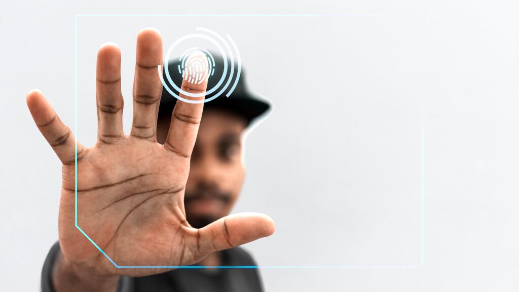 Open hand held up to a digital fingerprint scan graphic, illustrating Afghanistan visa biometrics