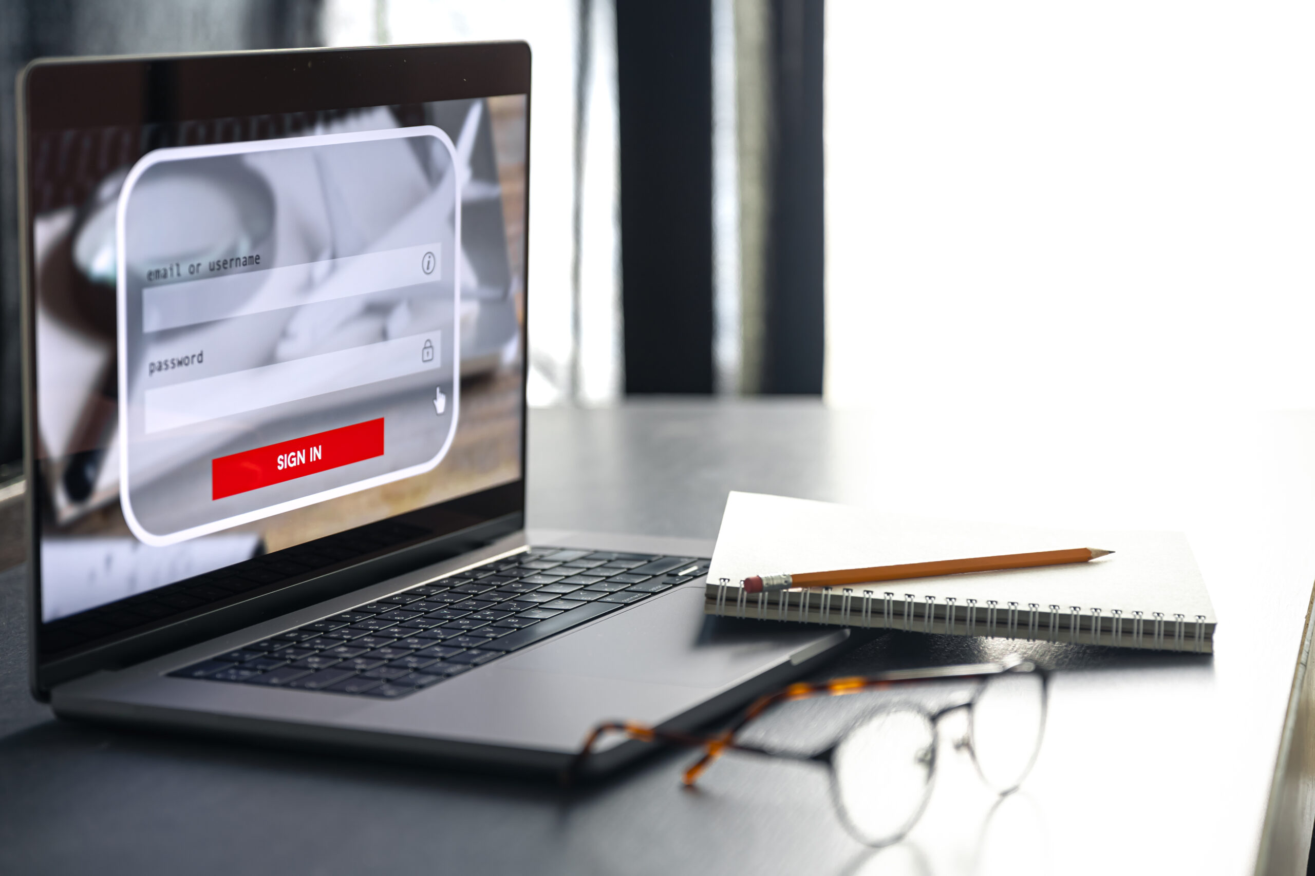 Laptop showing an online sign-in screen on a desk, representing the MyFWC portal for dismissal cases